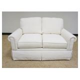 1160	BASSET IVORY UPHOLSTERED LOVESEAT, APPROXIMATELY 59 IN X 39 IN X 30 IN HIGH