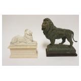 1182	PAIR OF CAST COMPOSITION LIONS ON BASES, LARGEST APPROXIMATELY 4 IN X 7 1/4 IN X 9 IN HIGH