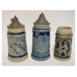 1202	GROUP OF 3 VINTAGE GERMAN STEINS, TALLEST APPROXIMATELY 8 1/2 IN HIGH