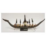 1228	MINIATURE MODEL ASIAN BOAT W/PEOPLE ROWING, APPROXIMATELY 19 IN X 2 IN X 8 IN HIGH