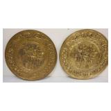 1250	PAIR OF LARGE BRASS EMBOSSED WALL CHAARGERS DEPICTING PUB SCENE, APPROXIMATELY 22 1/2 IN
