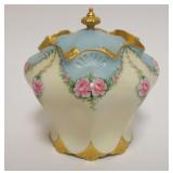 1012	HAND PAINTED PORCELAIN COVERED JAR, ROSES W/GILT TRIM ACCENTS, ARTIST SIGNED & DATED, APPROXIMA