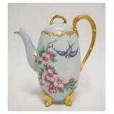 1017	HAND PAINTED PORCELAIN TEAPOT W/IMAGES OF FLOWERS & BLUE BIRDS, GILT ACCENTS & TRIM, ARTIST SIG