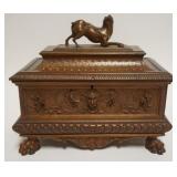 1058	OUTSTANDING CARVED DRESSER BOX WITH CARVED LIONS HEADS, PAW FEET AND CROUCHED DOG AT LID TOP, APPROXIMATELY 11 IN X 6 IN X 10 IN H