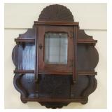 1153	VICTORIAN WALNUT HANGING CURIO CABINET WITH BEVELED GLASS CENTER DOOR, APPROXIMATELY 23 INX 8 I