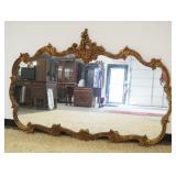 1176	HANGING MIRROR IN ORANTE CARVED GILT WOOD FRAME, APPROXIMATELY 69 IN X 47 IN H
