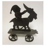 1242	FOLK ART METAL MECHANICAL PULL TOY W/MAN W/CAP RIDING A GOAT, APPROXIMATELY 13 IN X 7 IN X 14 I