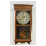 1096	INGRAHAM OAK CASE CALENDAR CLOCK REGULATOR W/REDMAN TOBACCO ADVERTISEMENT, APPROXIMATELY 5 IN X