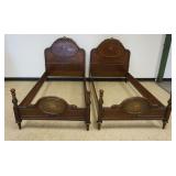 1138	BERKEY & GAY PAIR OF SINGLE BEDS W/MEDALION FLORAL PAINT DECORATED HEADBOARD & FOOT BOARD, CARVED CREST AT HEADBOARD TOP, BURLED WOOD HEADBOARD, EACH APPROXIMATELY 41 IN X 78 IN X 9 IN HIGH
