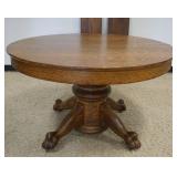 1145	ROUND OAK CLAW FOOT TABLE W/2 LEAVES, APPROXIMATELY 48 IN X 29 IN HIGH, LEAVES APPROXIMATELY 12