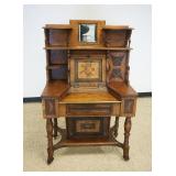 1150	UNUSUAL OAK FALL FRONT DESK W/CARVED IMAGES OF FLOWERS, LEAVES, CATTAILS & QUARTER MOONS, SOME 