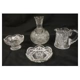 1012	GROUP OF ASSORTED CUT GLASS INCLUDING DECANTOR, CANDY DISH, PITCHER & SMALL FOOTED BOWL, TALLES