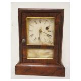 1057	ANTIQUE MINIATURE SETH THOMAS SHELF CLOCK, APPROXIMATELY 7 IN X 4 IN X 9 IN HIGH