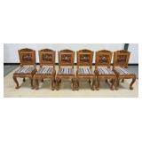 1099	SET OF 6 HEAVILY CARVED TEAK CHAIRS WITH 3 DIMENSIONAL CARVED IMAGES ON FRONT AND BACK WITH CUS