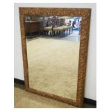 1109	BEVELED GLASS HANGING MIRROR IN ORNATE GILT FINISHED FRAME, APPROXIMATELY 36 IN X 48 IN