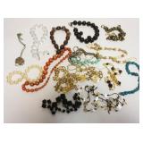1202	SELECTION OF APPROXIMATELY 16 COSTUME NECKLACES, SOME WITH MATCHING EARRINGS AND SOME WITH MAKE