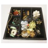 1205	LEATHER DRESSER BOX WITH RINGS, NECKLACES, PINS AS FOUND