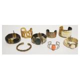 1209	SELECTION OF APPROXIMATELY 8 DEISGINER CUFFS AND BRACELETS AS FOUND