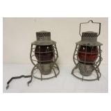 1060	2 DEITZ RAILROAD LANTERNS WITH RED GLOBES, BOTH STAMPED *CITY OF NEW YORK*, APPROXIMATELY 12 IN