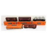 1068	LIONEL TRAINS #3484 OPERATING BOX CAR, #6454  2 BOX CARS, #6415 TANK CAR
