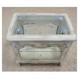 1180	ORNATE SMALL DOUBLE DOOR DISPLAY CABINET WITH BEVELED GLASS, FLORAL DECORATED TOP AND ADJUSTABL