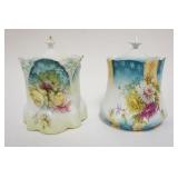 1035	2 VICTORIAN BISCUIT JARS EACH HAVING IMAGES OF FLOWERS, APPROXIMATELY 6 IN X 6 IN X 8 IN