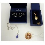 1092	SWAROVSKI CRYSTAL JEWELRY, AMBER GOLD TONE NECKLACE IN BOX, PIERCED EARRINGS, HEART NECKLACE ON