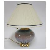 1166	DRIP GLAZED POTTERY TABLE LAMP ON BRASS BASE, APPROXIMATELY 15 IN H