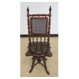 1184	UNUSUAL MAHOGANY HIGH BACK SWIVEL PIANO STOOL WITH TURNED SIDES AND BASE, PAW FEET AND WOOD WOV