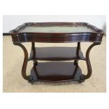 1199	MAHOGANY SERVING CART WITH GREEN LEATHER TOP AND WHEELS, SOME WEAR TO LEATHER TOP, APPROXIMATEL