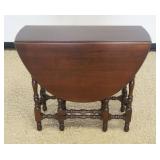 1204	NARROW MAHOGANY OVAL GATE LEG TABLE WITH 1 DRAWER, CLOSED APPROXIMATELY 14 IN X 36 IN X 31 IN H