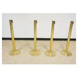 1211	GROUP OF 4 BRASS SHEATHED STANCHIONS, EACH APPROXIMATELY 41 IN H X 14 IN ROUND BASE
