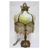 1006	ANTIQUE ART NOUVEAU PANELED CURVED SLAG GLASS TABLE LAMP HAVING BEADED TASSLES, APPROXIMATELY 2