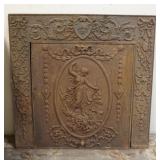 1067	ANTIQUE CAST IRON FIREPLACE COVER WITH CAST IMAGE OF VICTORIAN WOMAN, APPROXIMATELY 31 IN X 31 