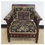 1101	ORNATE CARVED VICTORIAN UPHOLSTERED ARM CHAIR, APPROXIMATELY 27 IN C 24 IN X 28 IN H