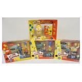 1152	THE SIMPSONS PLAYMATES FIGURES AND RUBIKS CUBE UNOPENED