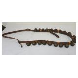 1073	BRASS SLEIGH BELLS, 20 MOUNTED ON LEATHER STRAP, BELLS APPROXIMATELY 2 1/2 IN