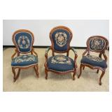 1250	GROUP OF 3 VICTORIAN FINGER CARVED WALNUT NEEDLE POINT PARLOR CHAIRS AND ROCKER