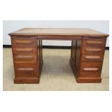 1275	CHESTNUT 8 DRAWER DESK WITH PULL OUT SURFACES AND PANELED SIDES, APPROXIMATELY 54 IN X 33 IN X 