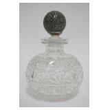 1003	CUT GLASS BOTTLE W/STERLING TOP STOPPER, BOTTLE APPROXIMATELY 6 1/2 IN HIGH