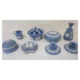 1110	GROUP OF ASSORTED WEDGWOOD BLUE JASPERWARE INCLUDING VASES, COVERED TRINKET BOXES, CANDLESTICKS
