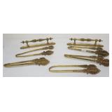 1243A	ORNATE BRASS TIE BACKS AND BRASS HANDLES, EACH APPROXIMATELY 11 IN LONG