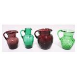 1254	GROUP OF ASSORTED COLORED BLOWN GLASS PITCHERS, TALLEST APPROXIMATELY 6 IN