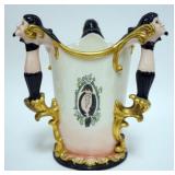 1032	LENOX BELLEEK HAND PAINTED LOVING CUP, 3 HANDLED  WITH FIGURAL HEADS, APPROXIMATELY 8 IN H