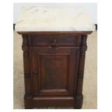 1255	VICTORIAN WALNUT MARBLE TOP STAND, HAVING 1 DRAWER AND 1 BURL PANELED DOOR, APPROXIMATELY 22 IN