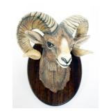 1060	BOEHM BIG HORN SHEEP MOUNTED ON WOOD, APPROXIMATELY 9 IN X 6 IN X 5 1/2 IN H