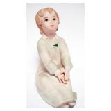 1111	LASZLO ISPANKY FIGURINE OF YOUNG GIRL SITTING, APPROXIMATELY 7 IN H