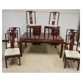 1260	CARVED ASIAN DINING TABLE AND CHAIRS WITH 2 LEAVES, CHAIRS HAVE PIERCED CARVED BENTWOOD BACKS A
