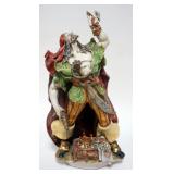 1061	ITALIAN TERRACOTTA FIGURE OF A PIRATE EXAMINING JEWELS FROM HIS TREASURE CHEST, MARKED ON BASE 