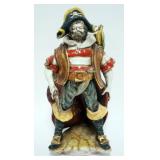 1062	ITALIAN TERRACOTTA FIGURE OF A PIRATE STANDING WITH GUN IN HAND AND PARROT ON SHOULDER, APPROXI